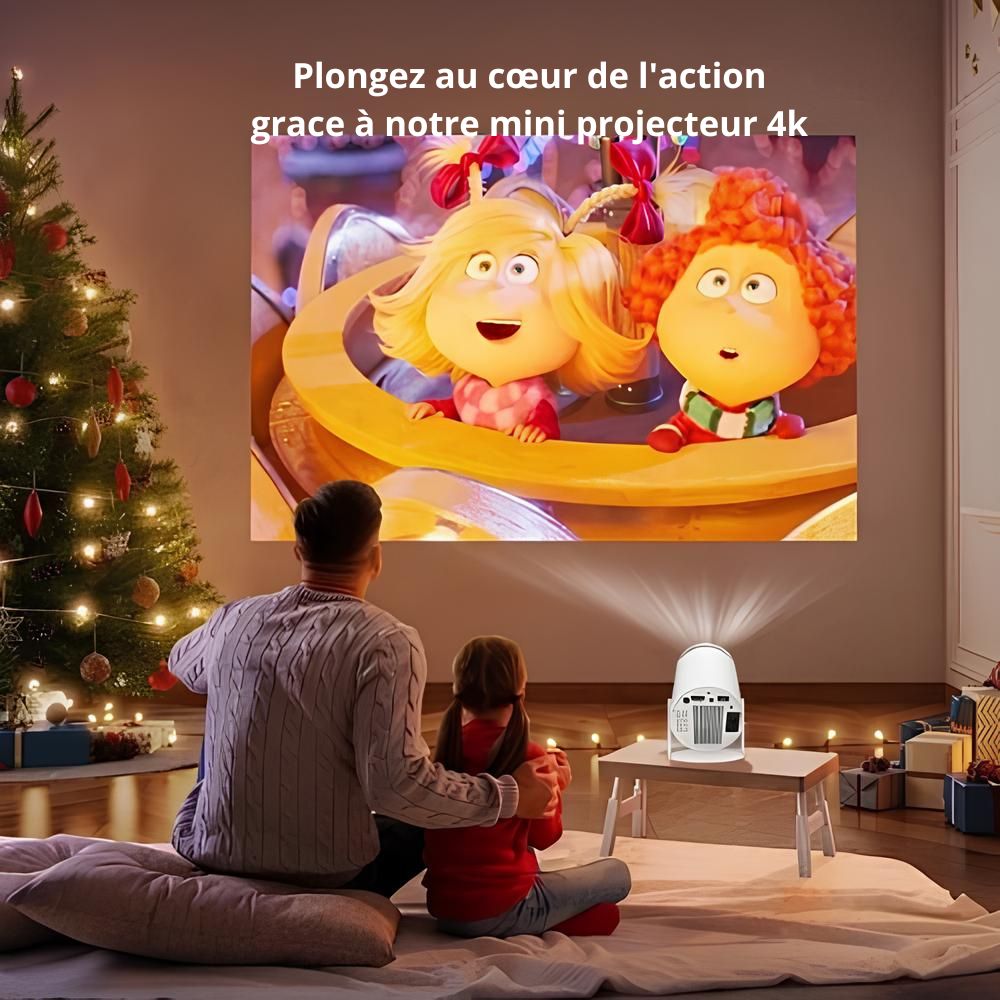 Un père et sa fille regardant un film pour enfant avec un vidéoprojecteur piqflix posé sur une table